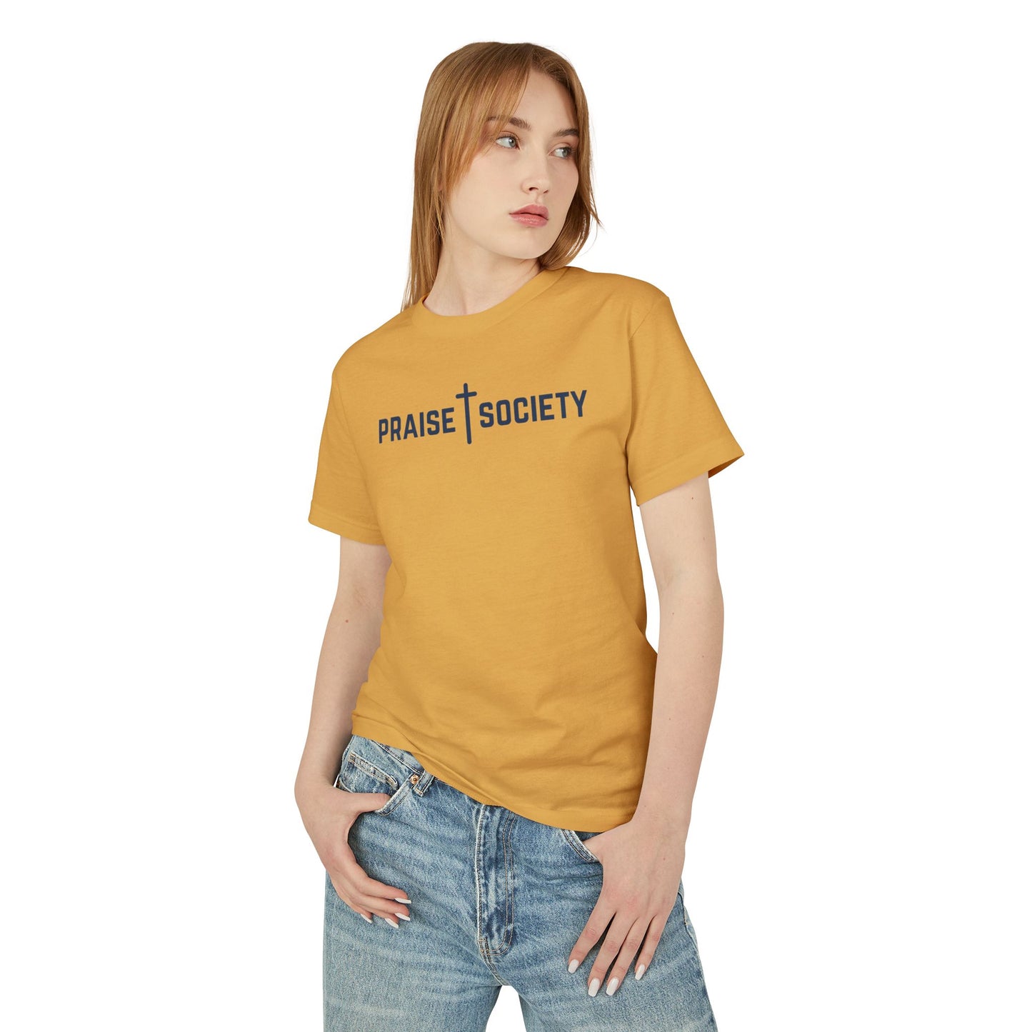 Woman wearing a mustard yellow t-shirt with 'Praise Society' text on a white background