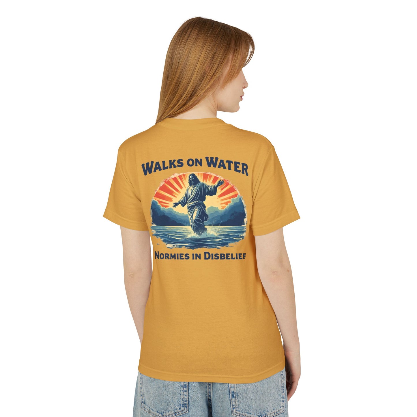 Woman wearing a mustard yellow t-shirt with a Jesus and text on the back.