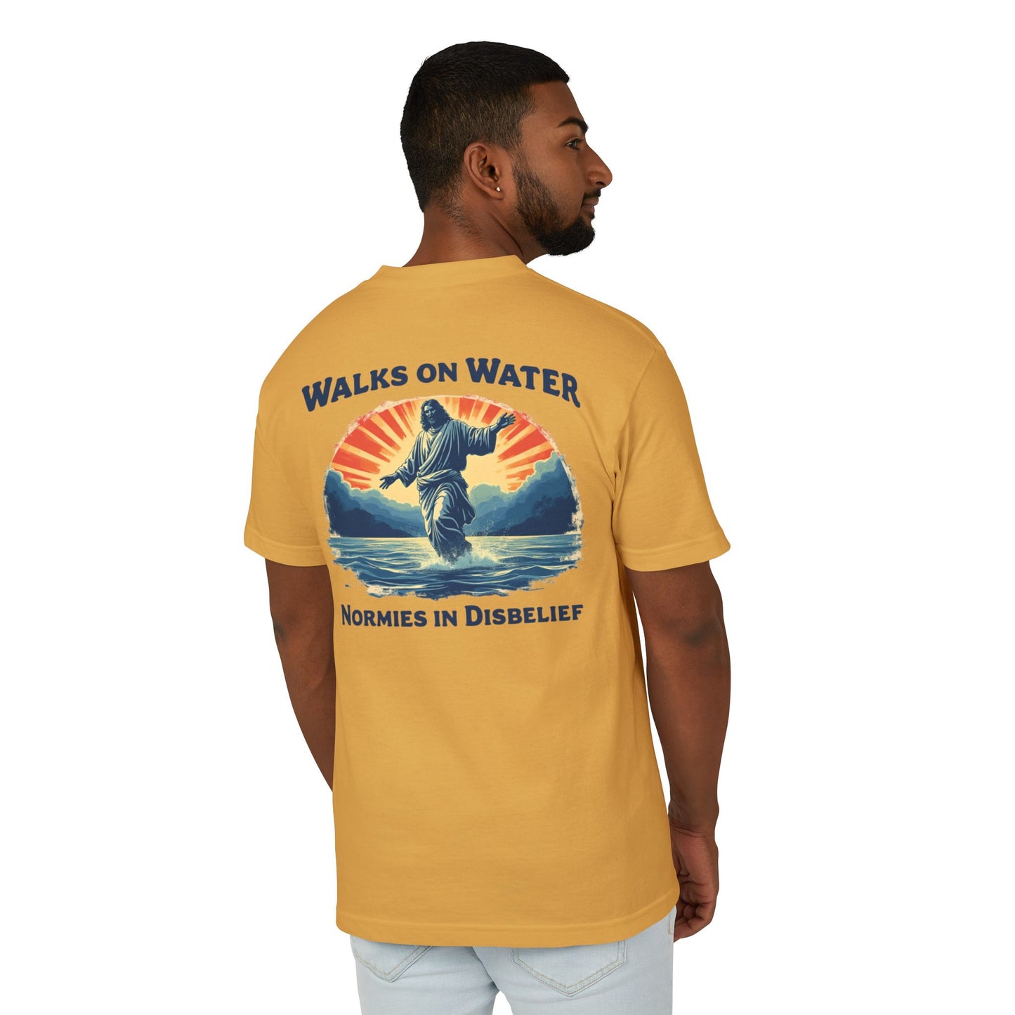 Man wearing a yellow t-shirt with a graphic design of Jesus and text on the back.