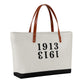 1913 Bitcoin Tote cream and black with brown leather straps available at the orange habit