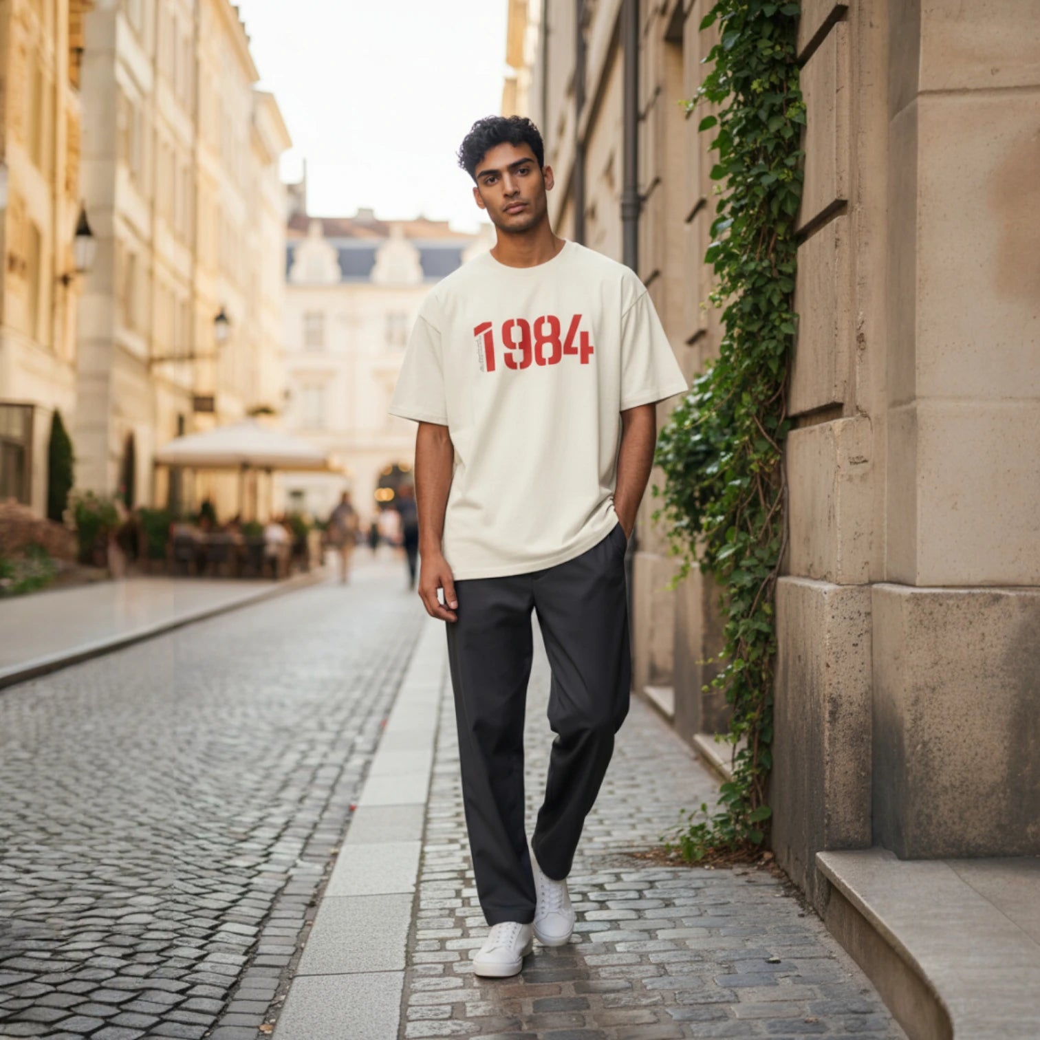 Man wearing a white Bitcoin t-shirt from SVRN Society with '1984' printed on it.
