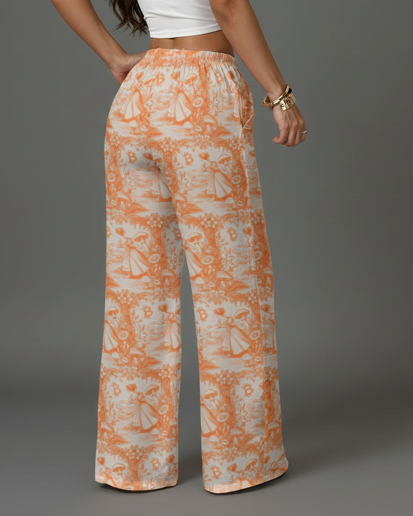 Person wearing orange and white patterned pants in a living room setting.