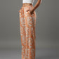 women wearing orange bitcoin rabbit hole pants - svrn society
