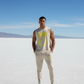 Man wearing a sleeveless bitcoin satoshi smiles shirt with a smiley face design on a salt flat landscape - SVRN Society