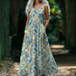 Woman wearing a floral dress in a natural setting