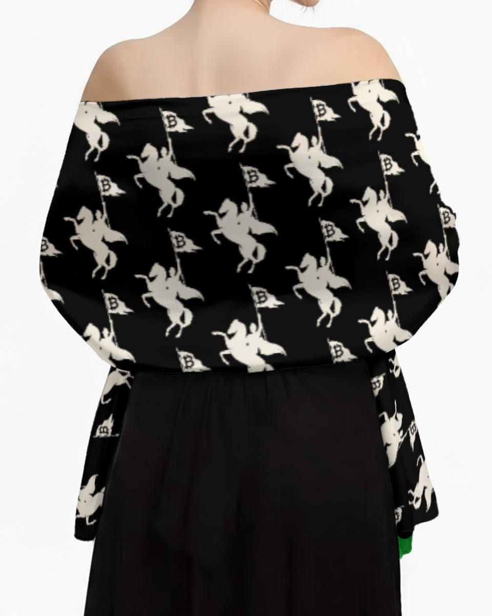 Black off-shoulder top with white graphic design on a plain background