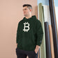 Man wearing a (Dark Green) hoodie with a Bitcoin logo against a beige wall.