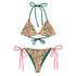 Bitcoin Rio two-piece bikini set with a colorful floral print on a cream background, featuring dark green tie straps on the top and bottom, and pink side-tie straps on the bottom.