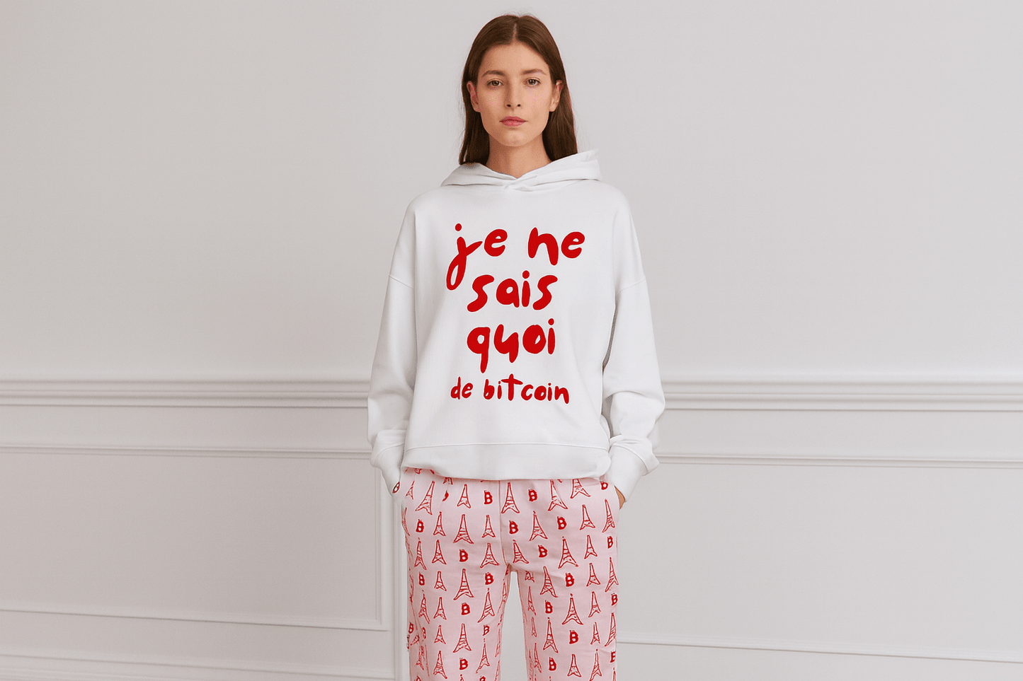 Generated image of female model wearing white "je ne sais quoi de bitcoin" hoodie with matching Eiffel Tower and Bitcoin print wide-leg pants