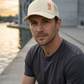 Ivory 1971 trucker cap waterfront lifestyle portrait