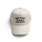 Beige cap with text 'Moms Against Money Printing' on a white background