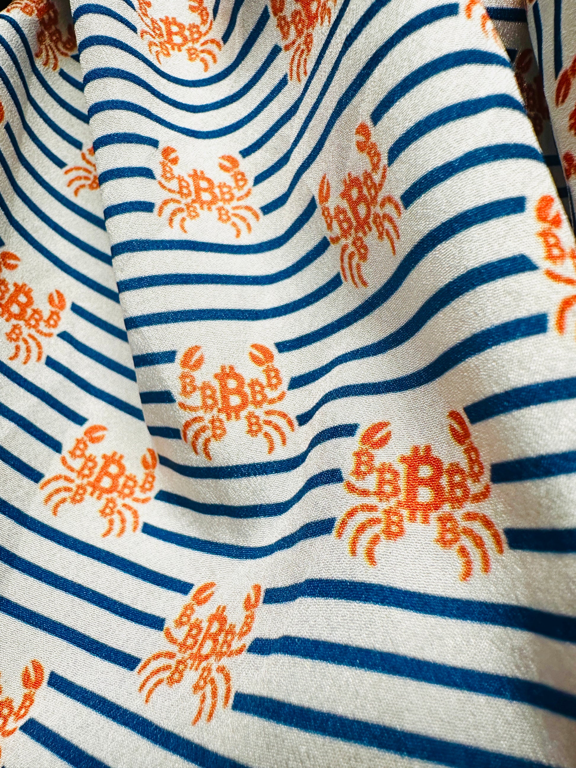 close-up of material and pattern of nautical crab bitcoin b design shirt