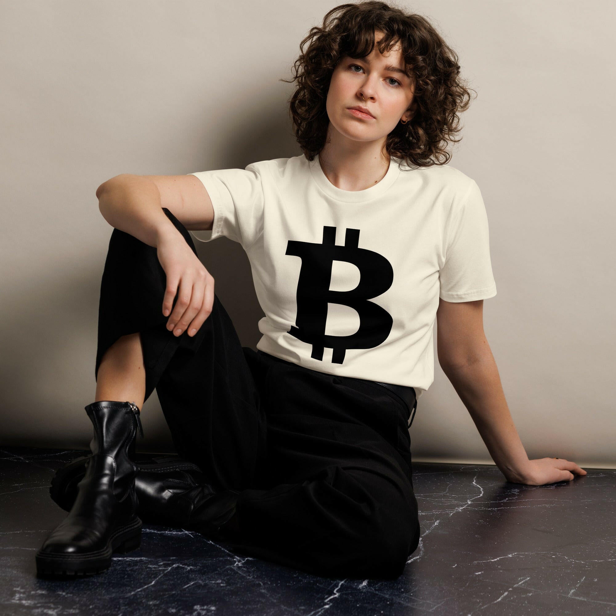 woman wearing cream colored THE B | Premium Bitcoin T-shirt with large black bitcoin b by Nikki Nakamoto - The Orange Habit