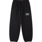 Black SVRN Society logo sweatpants with a white logo on a white background