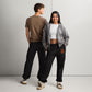 two people wearing Unisex Bitcoin sweatpants relaxed fit with Orange B logo by SVRN_T