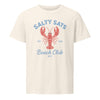 An off-white short-sleeve Bitcoin t-shirt with a graphic print featuring a red lobster and blue text reading 'SALTY SATS Beach Club BTC'.