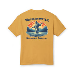 Yellow t-shirt with a graphic of Jesus walking on water and text on a white background
