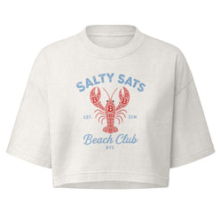 A white cropped Bitcoin t-shirt with a red lobster graphic and blue text reading 'SALTY SATS Beach Club' on the front, displayed against a solid white background.